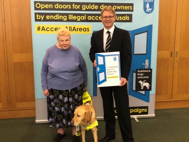 guide dog with David Morris MP 